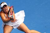 Caroline Wozniacki fires back a return