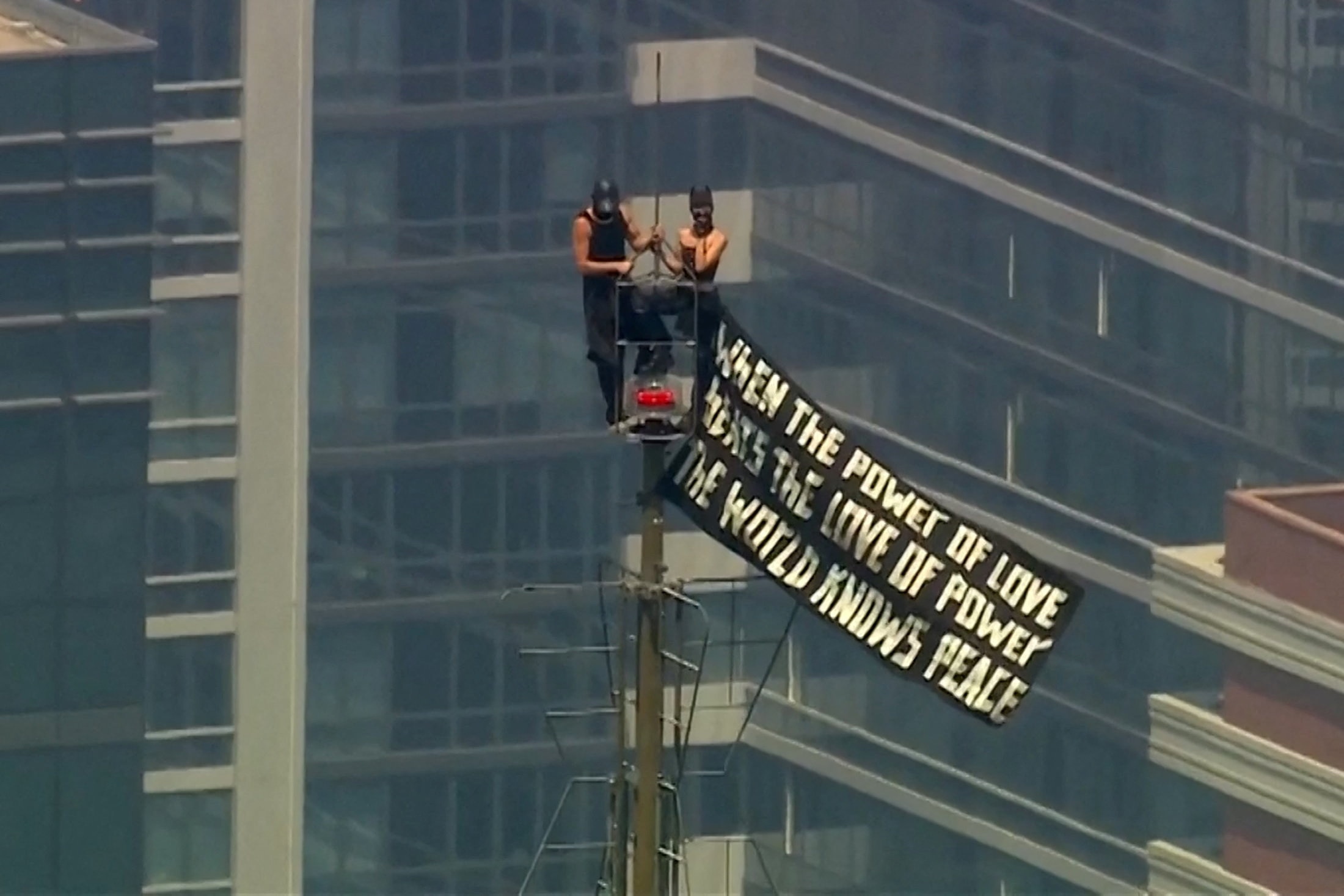 Russian daredevils climb Empire State Building to unfurl 'love' banner