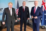 Boris Johnson, Scott Morrison and Joe Biden pose for a photo.