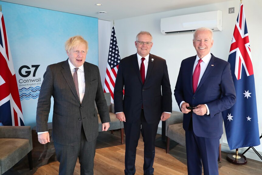 Boris Johnson, Scott Morrison and Joe Biden pose for a photo.