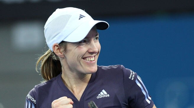 Justine Henin celebrates her first-round win over Nadia Petrova.