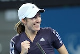 Justine Henin celebrates her first-round win over Nadia Petrova.