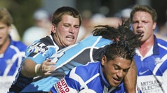 Matt Utai tries to break free of the Cronulla defence.