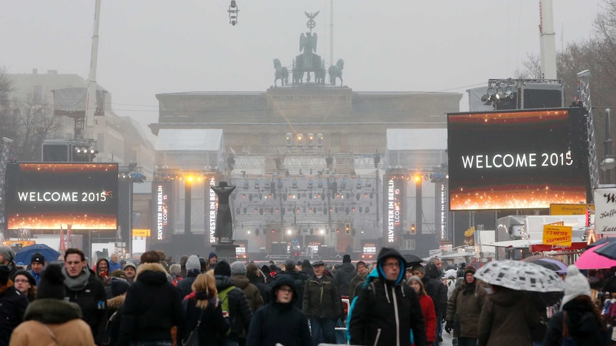 People attend New Year celebrations at the Brandenburger Tor gate in Berlin December 31, 2014