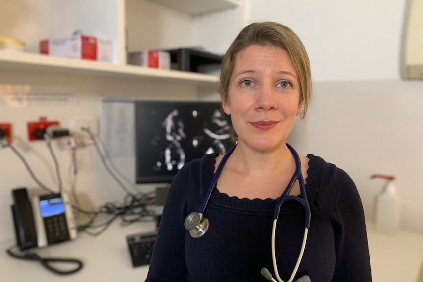 A female doctor with a stethoscope around her neck