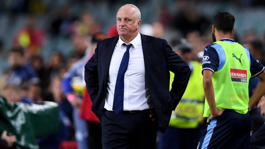 Sydney FC coach Graham Arnold looks on after his team's loss to Melbourne Victory.