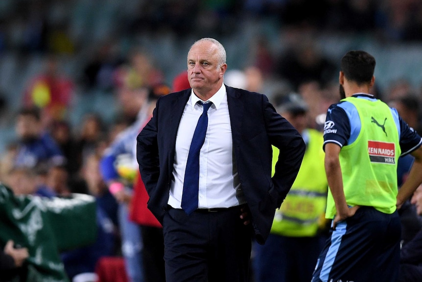 Graham Arnold looks on after Sydney FC's loss to Melbourne Victory