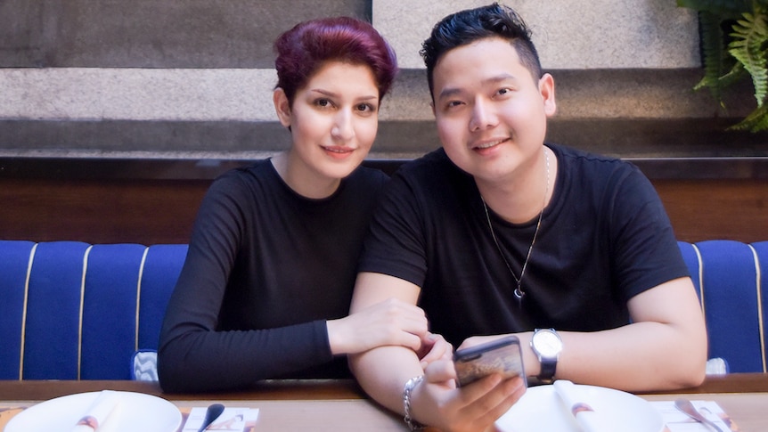 Couple sitting at a restaurant table