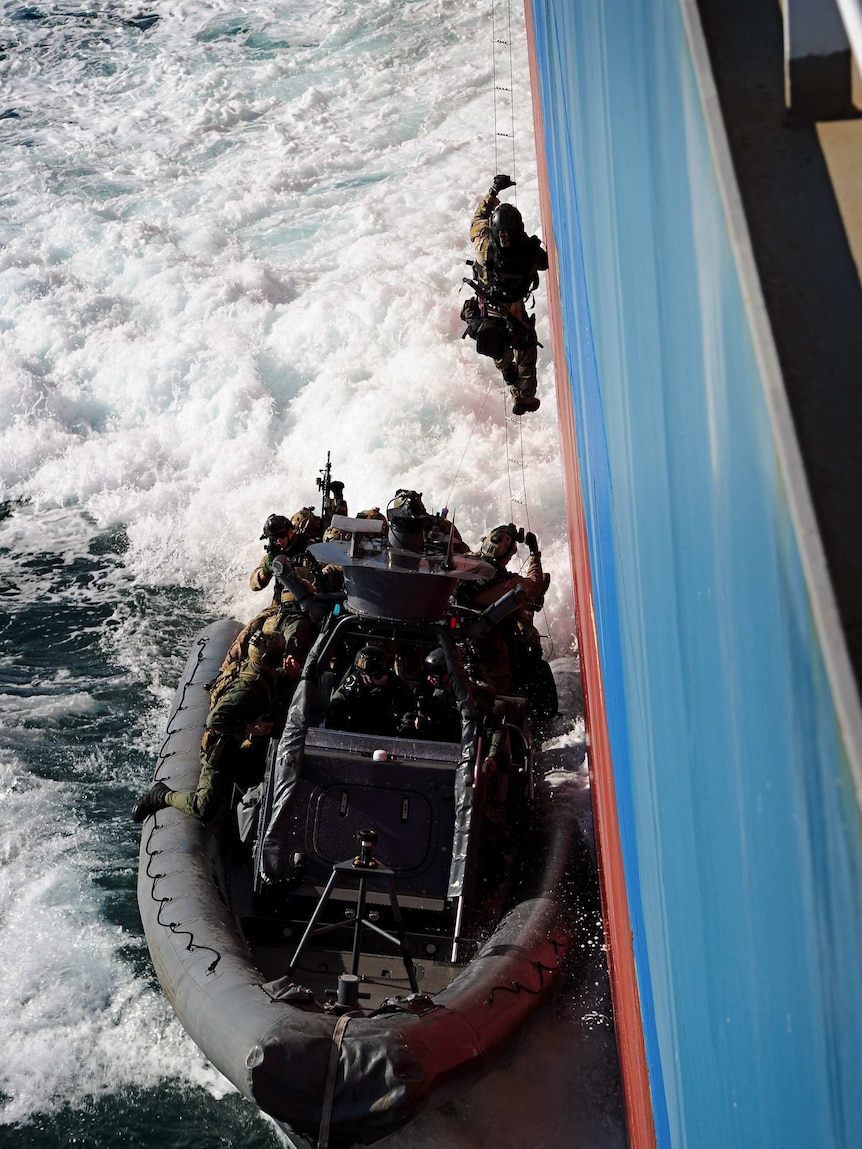 Special Air Service Regiment troops board the bulk carrier.