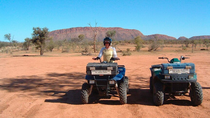 Quad-biking in the Northern Territory's Red Centre, at the base of the MacDonnell Ranges