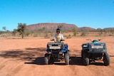 Quad-biking in the Northern Territory's Red Centre, at the base of the MacDonnell Ranges