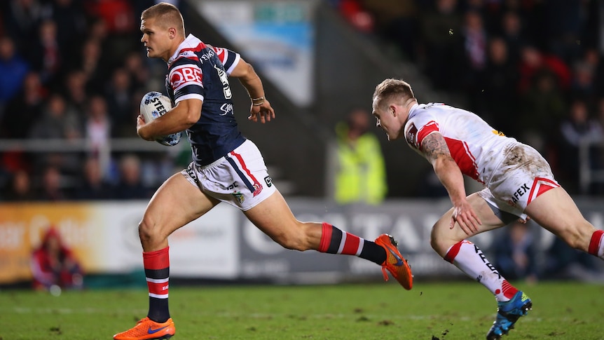 Sydney Roosters' Dale Copley beats Adam Swift of St Helens on way to score try in World Club Series.