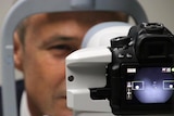 Health Minister Roger Cook getting his eye scanned by new technology that can detect diabetic retinopathy.