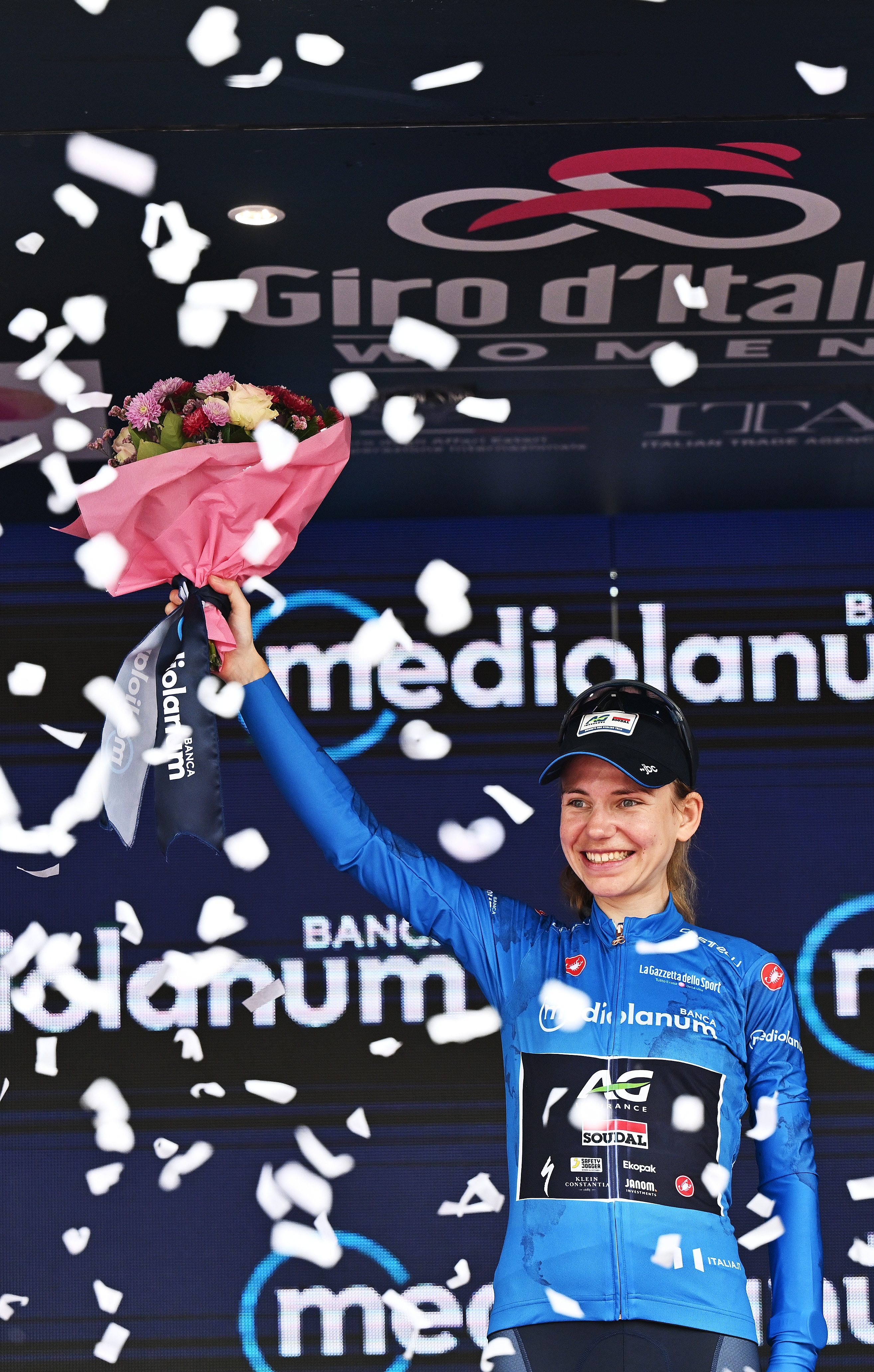 Sarah Gigante holds up a bouquet of flowers