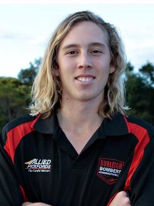 A smiling Sam Brown shows off his Burleigh Bombers uniform