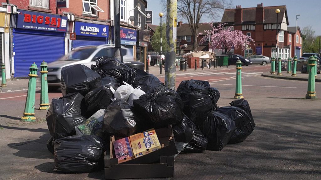 A pile of rubbish bags sits in a corner of a Birmingham street