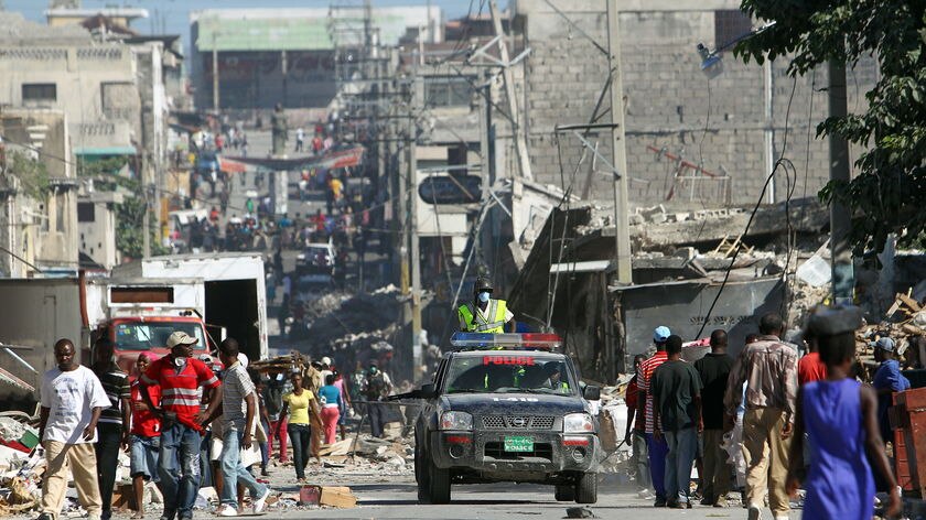 Haitian police patrol on a vehicle in the streets of the centre of Port-au-Prince