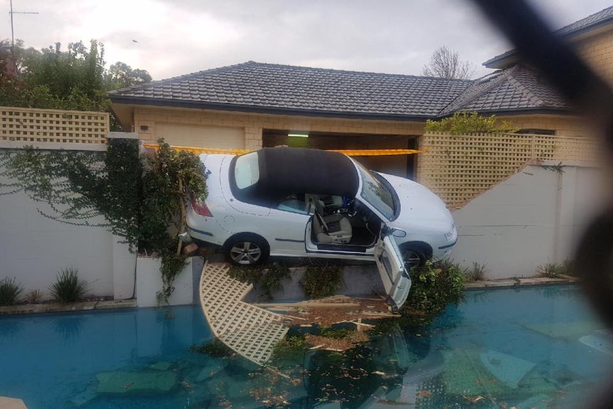 The car ended up on a fence after the driver hit the accelerator by mistake.