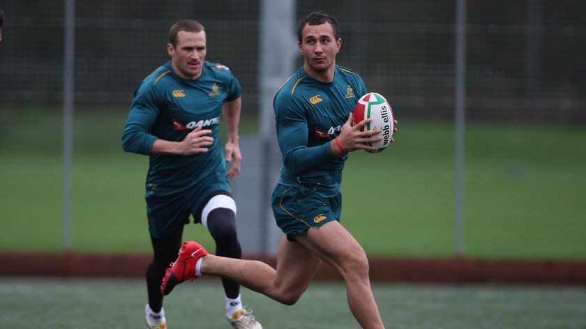 Doing too much? Matt Giteau (l) may have to move from half-back if Quade Cooper (r) returns on August 28.