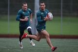 Selection questions ... Dropping Cooper (r) would mean Matt Giteau (l) may be called up to fill the void. (file photo)