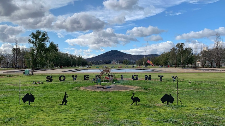 The word Sovereignty is spelled out at the Aboriginal Tent Embassy.