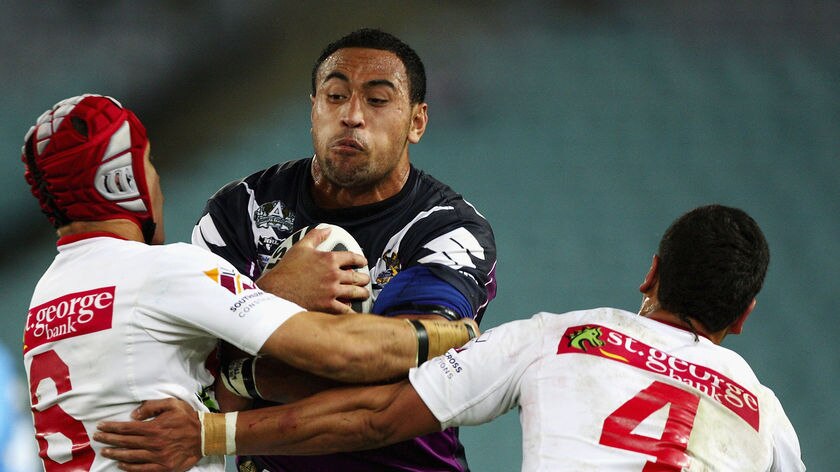 Antonio Kaufusi is tackled by the Dragons.