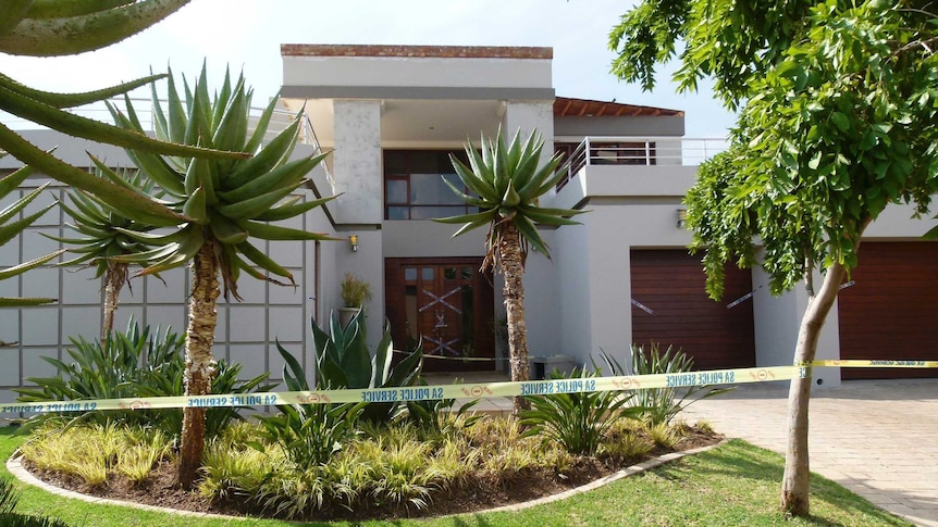 Police crime scene tape marks off the Pretoria home of Oscar Pistorius