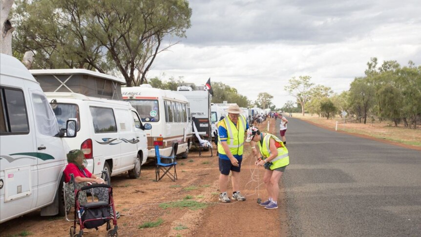 Officials measure a world-record attempt for a line of motorhomes in Barcladine, May 26, 2019