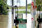 The BP service station on Gladstone Road, Rockhampton, is submerged by floodwaters