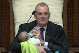 New Zealand speaker Trevor Mallard cradled and fed MP Tamati Coffey's baby in Parliament.
