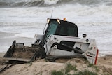 Bobcat working to protect sand dunes at West Beach during storms