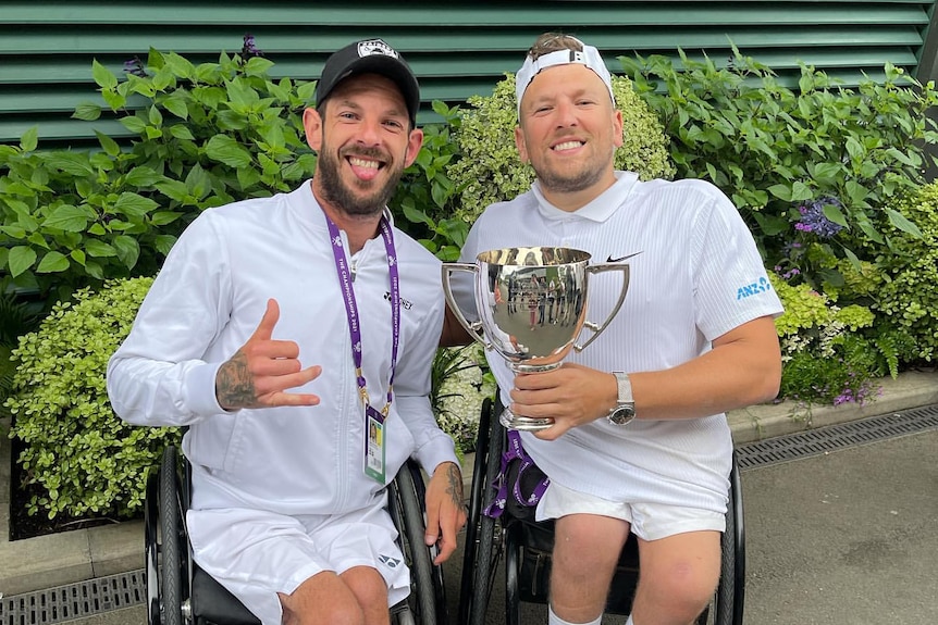 Heath Davidson (left) and Dylan Alcott (right) with the Wimbledon quads wheelchair tennis trophy in 2021.