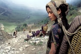 A Nepalese woman working in a mountain area.