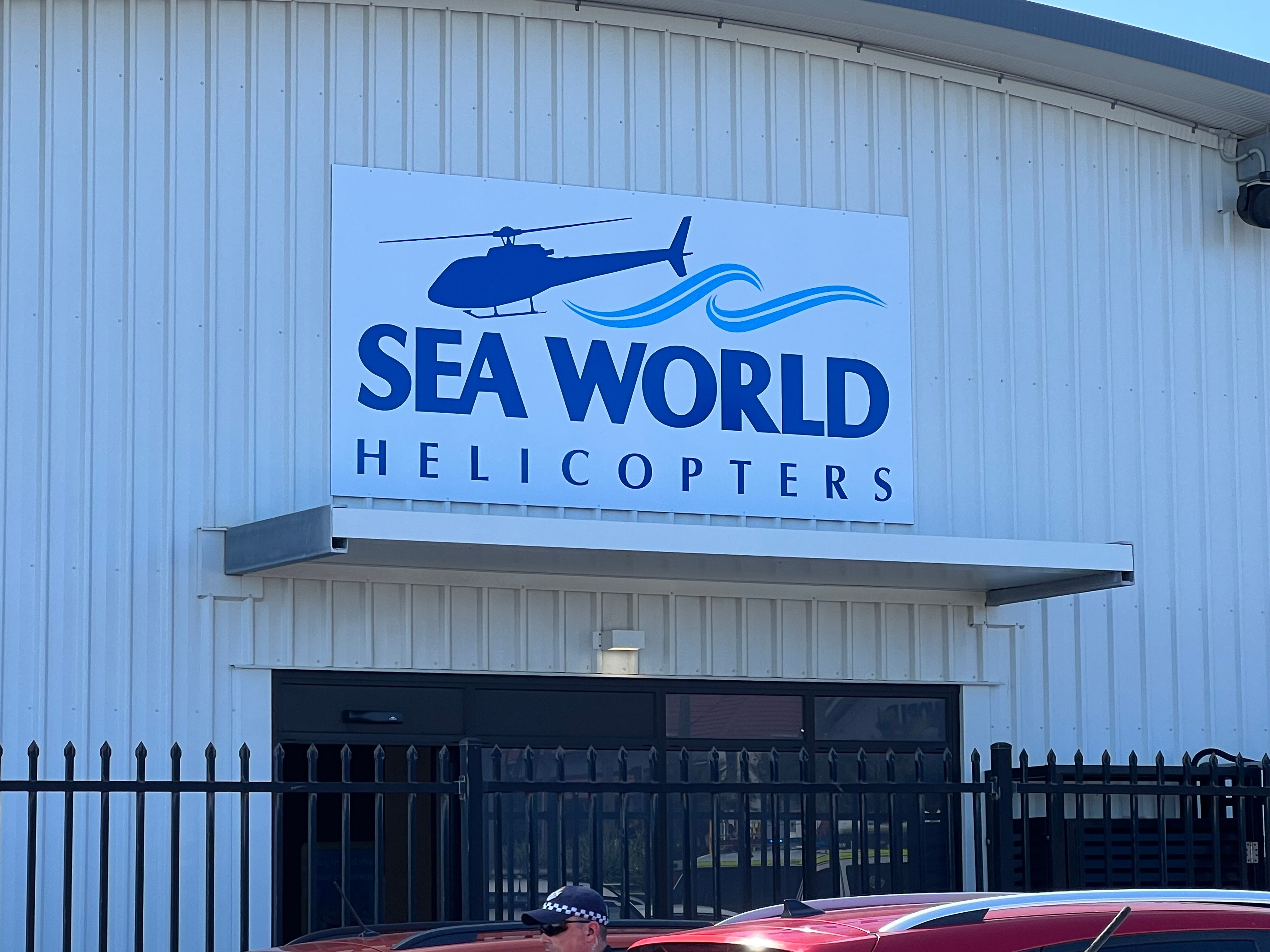 A sign saying Sea World Helicopters.