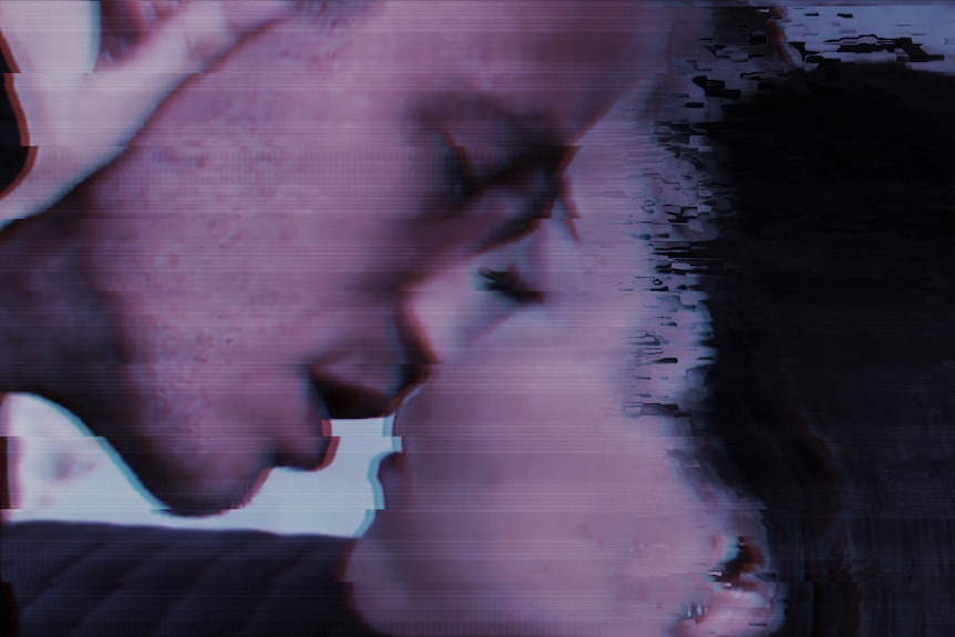 A blurry screenshot of a man kissing a woman