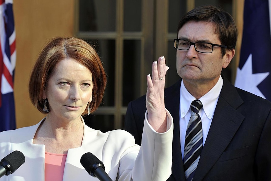 Julia Gillard and Greg Combet address the media (AAP: Alan Porritt)