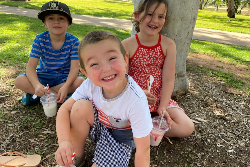 Clare Smith's three children smile for the camera.