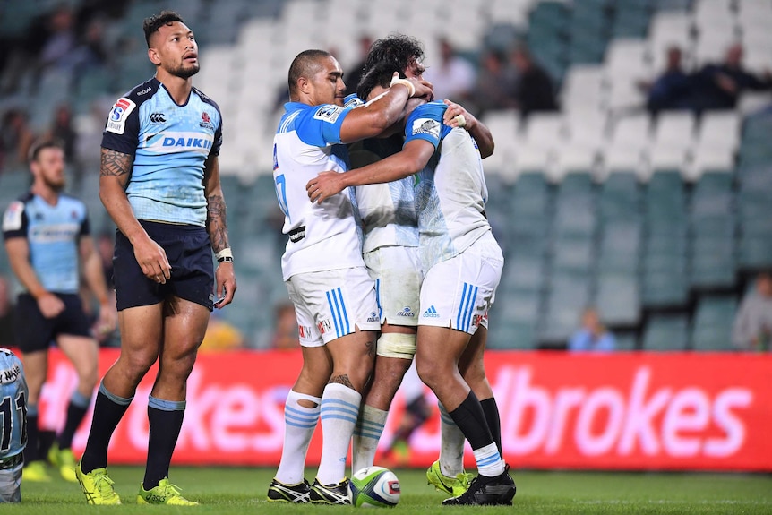 Israel Folau looks dejected after the Blues score a try against the Waratahs on Saturday night.