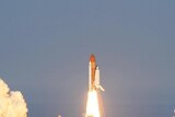 The space shuttle Discovery lifts off from Kennedy Space Centre on its final flight