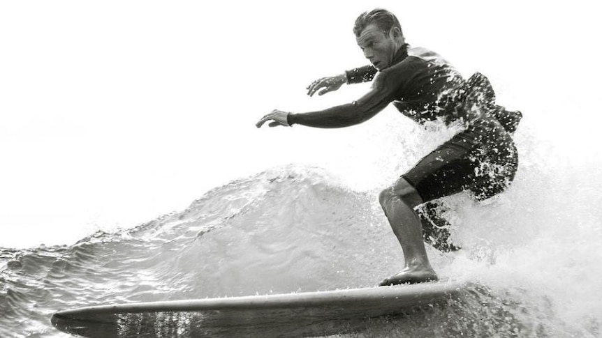 Black and white image of surfer