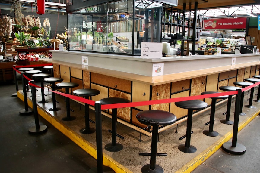 A food venue at Prahran Market in Melbourne with a red rope preventing customers from sitting down.