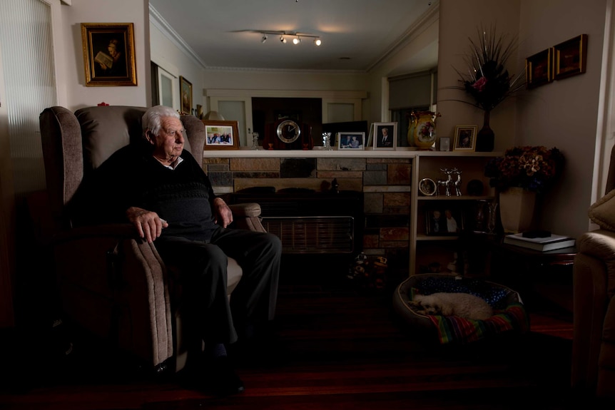 Roy McDonald sits in a chair and looks at the camera in his Melbourne home.