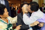 North Korean woman Koo Song-Ok (R), 71, kisses her South Korean father Koo Sang-Yeon (C), 98, as they bid farewell