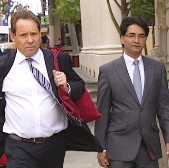 Lloyd Rayney (right) arrives at court with his lawyer in Perth
