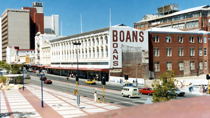 The Perth city Boans store building and surrounding streets, with cars and pedestrians.