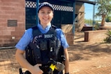 female police officer smiles at camera 