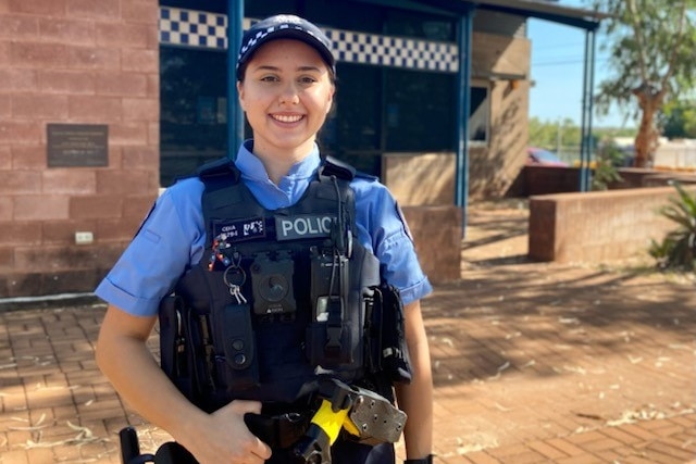 female police officer smiles at camera 