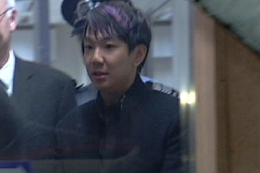 Wei Li arrived at Adelaide Airport in police custody