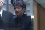 Wei Li in police custody