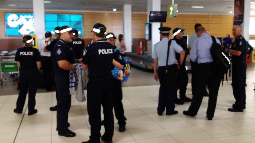 Some of the 700 extra police arriving at Cairns Airport for the G20 finance summit.
